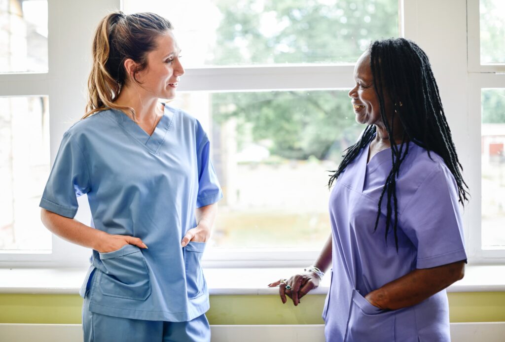 Nurses having a conversation in the hospital hall